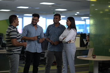 group of smiling colleagues in AtkinsRéalis Bengaluru office